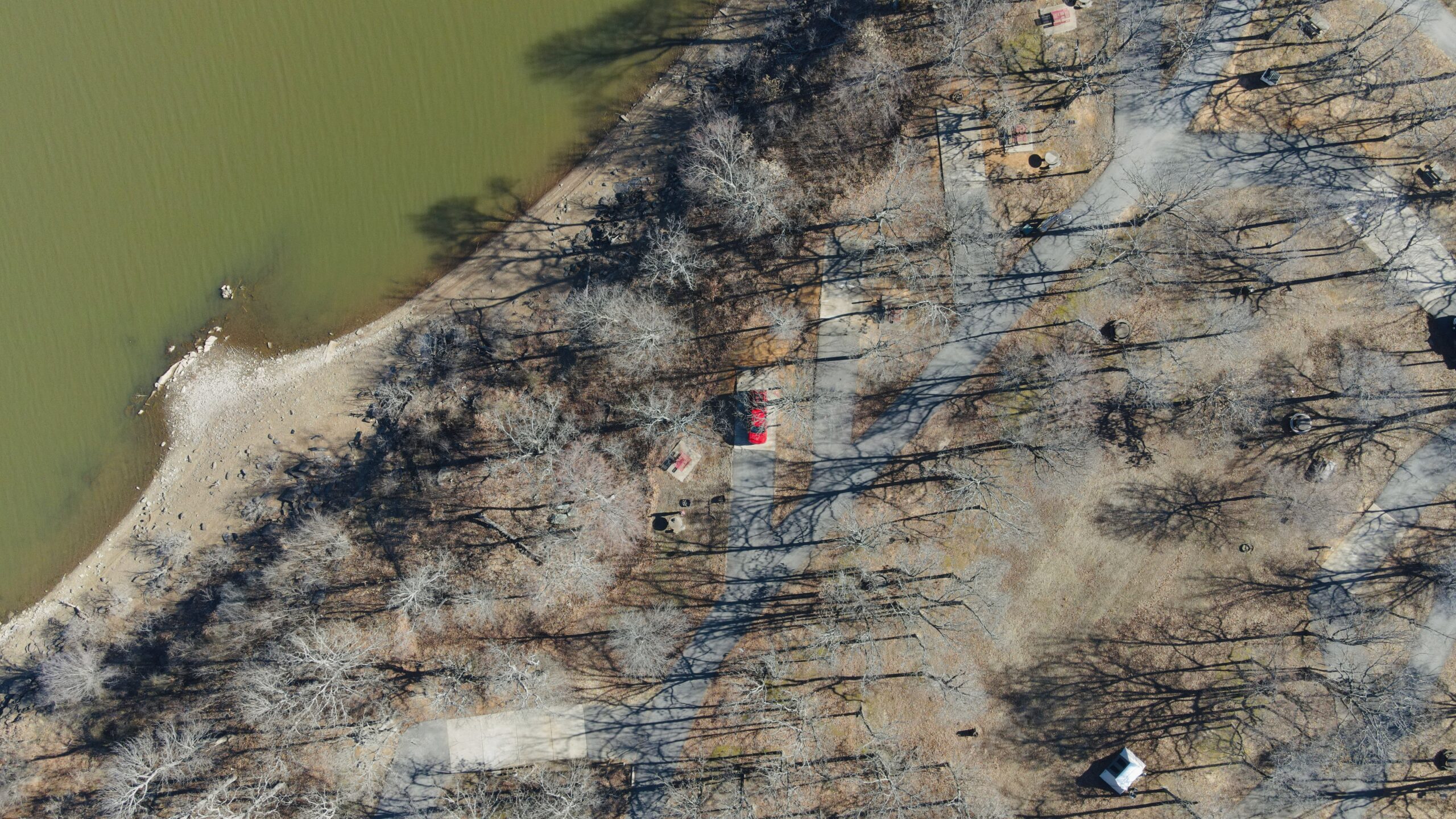 a red truck from above in a camping spot from a drone shot