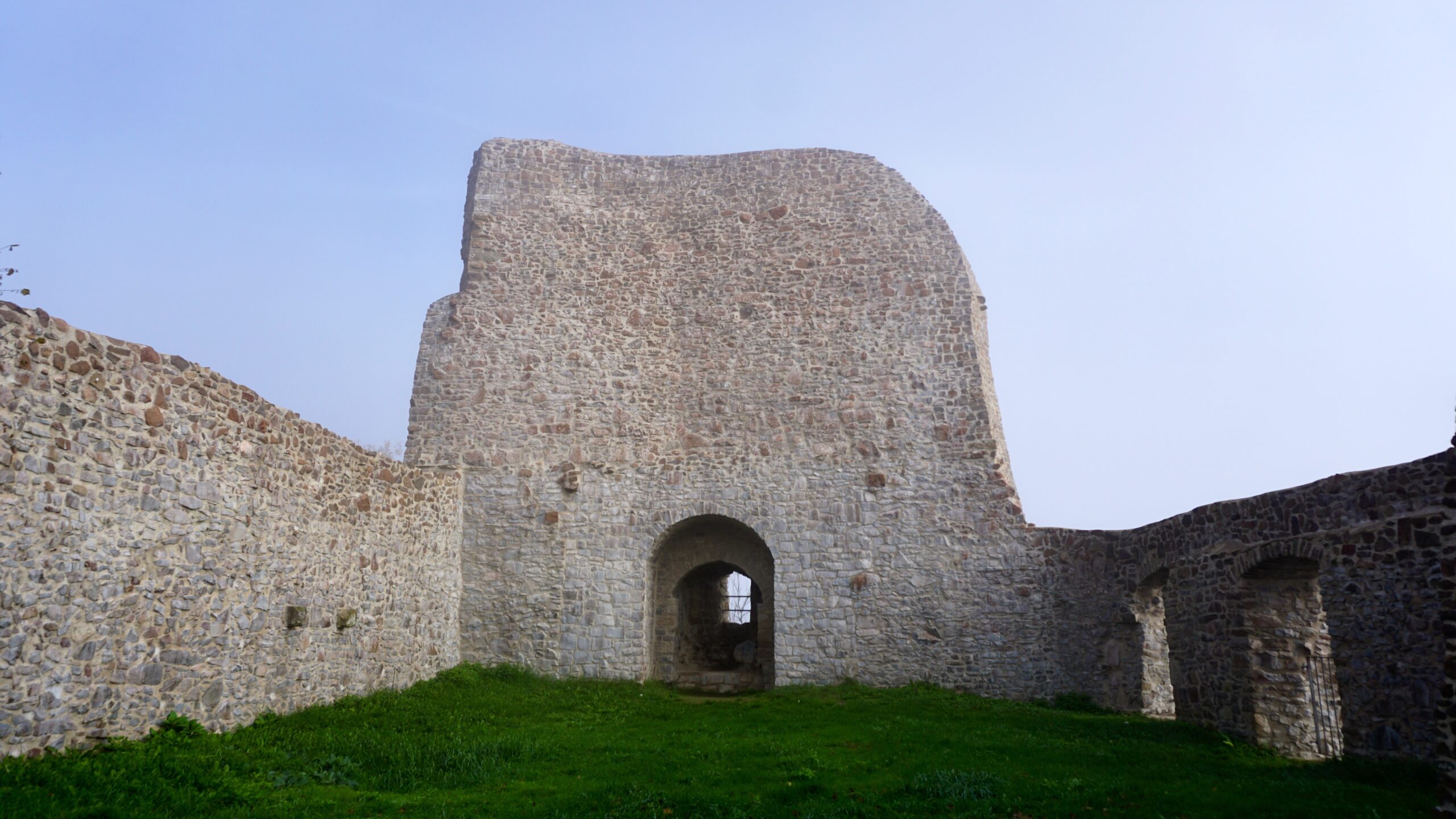 white stone walls with no roof and grass at michelsburg near kusel