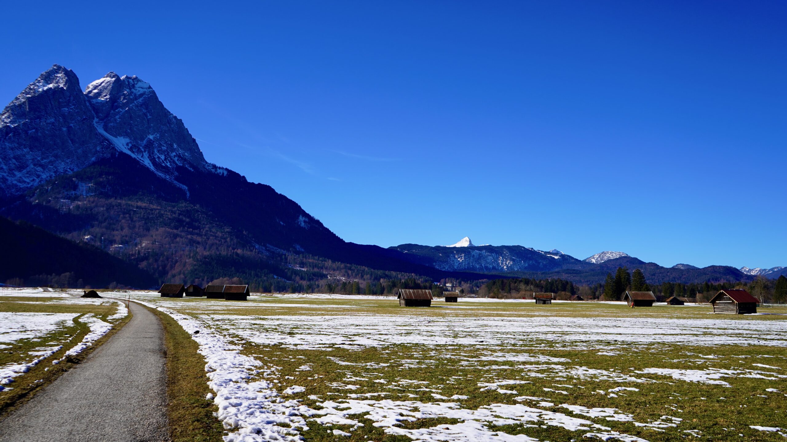 blue sky, a pointy mountain and snowy valley near edelweiss lodge in garmisch germany