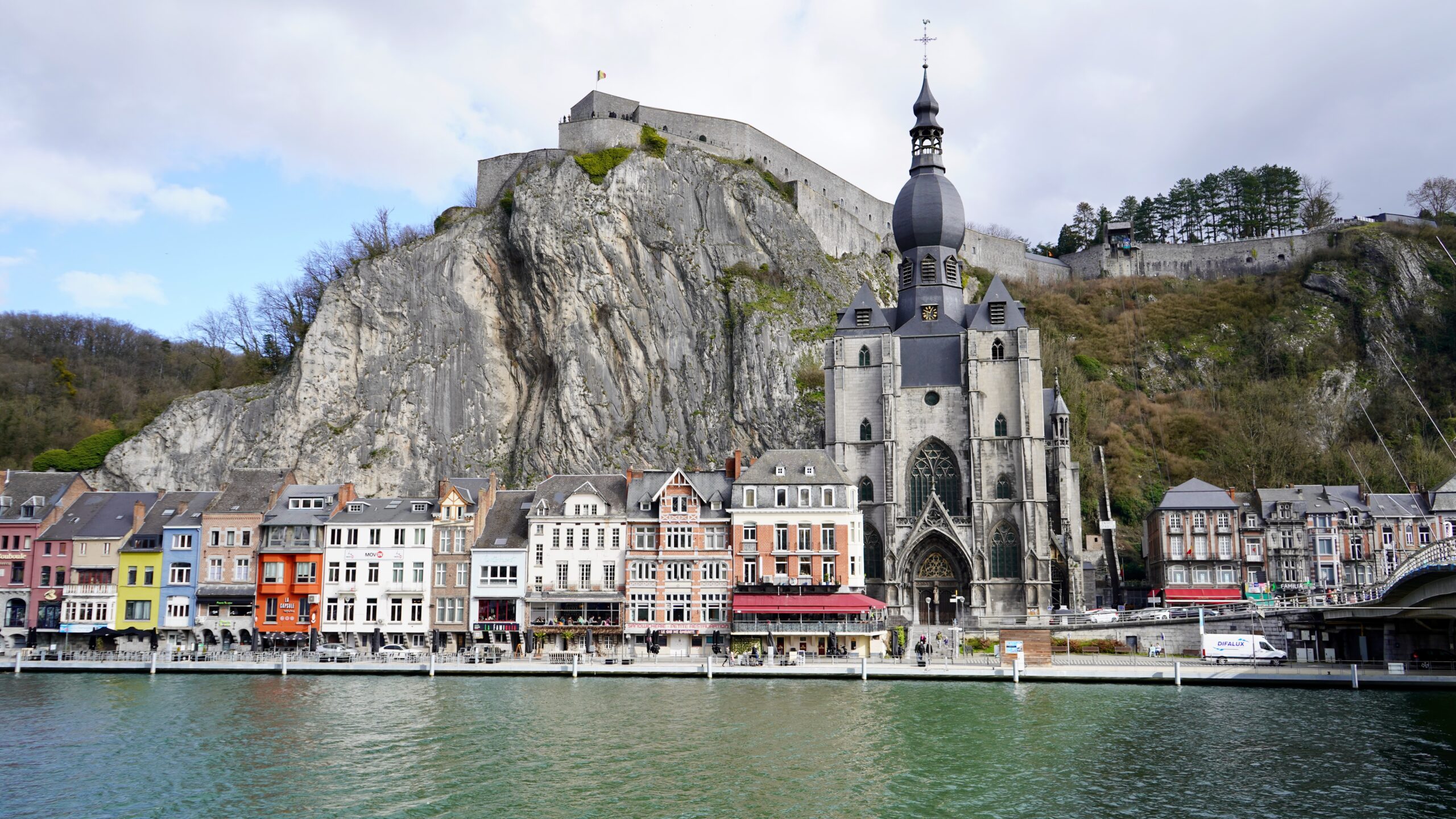 Dinant skyline with the church and citadel with row houses along the river