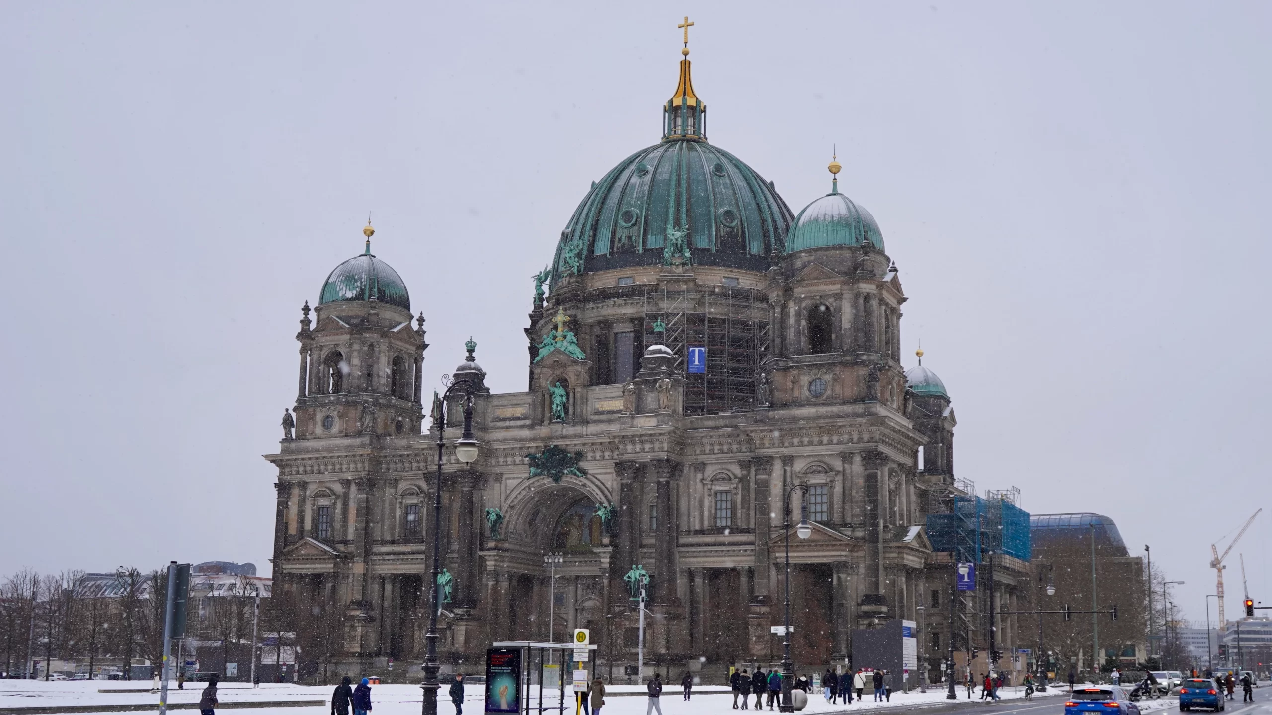 the Berlin Dom with snow falling and snow on the ground